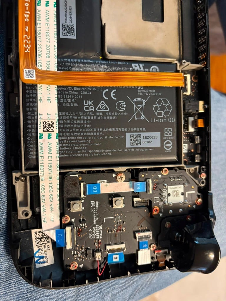 Opened ASUS ROG Ally handheld showing internal boards and battery